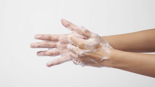 people use soap and washing hands on gray background. Concept Hy people use soap and washing hands on gray background. Concept Hygiene.